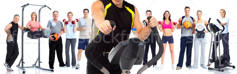 Man exercising on elliptical trainer. Stock photo © Kurhan
