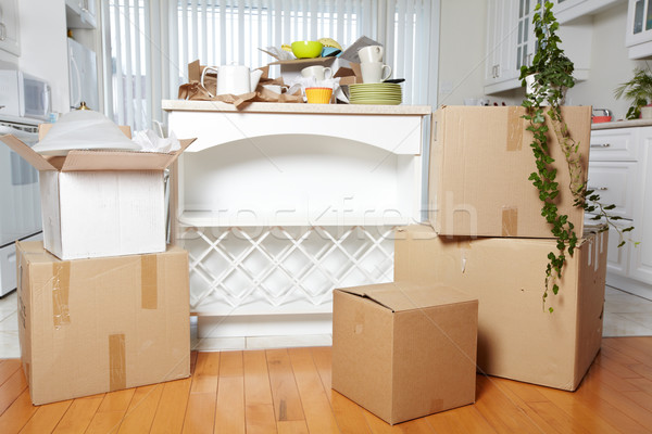 Stock photo: Moving boxes in new house.