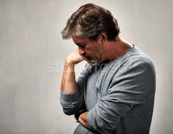 Abandonado homem deprimido retrato cinza parede Foto stock © Kurhan