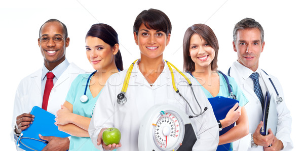 Stock photo: Doctor woman with scales and apple.