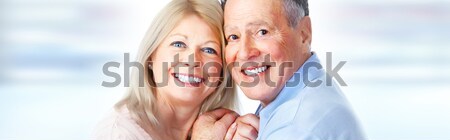 Idős pár mosolyog boldog idős pár kék Stock fotó © Kurhan