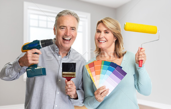 Senior couple with drill and painting roller Stock photo © Kurhan