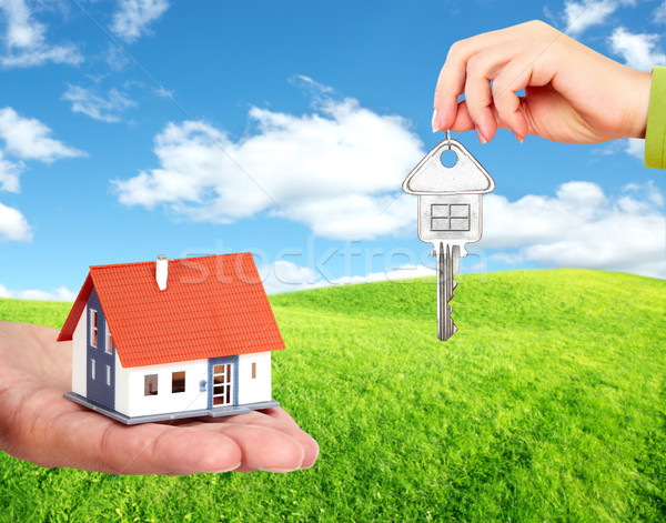 Hand with a little house and keys. Stock photo © Kurhan