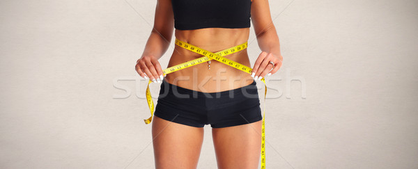Abdomen mètre à ruban jeune femme ventre régime alimentaire Photo stock © Kurhan