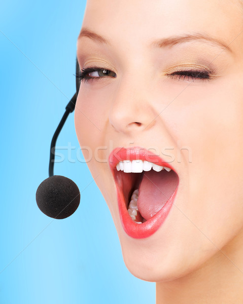 Call center operatore bella auricolare blu donna Foto d'archivio © Kurhan