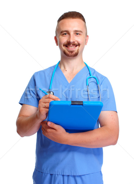 Young medical doctor with clipboard. Stock photo © Kurhan