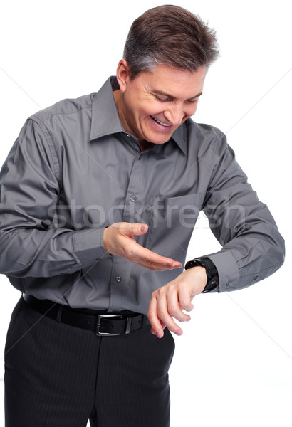 Businessman looking time at his watch. Stock photo © Kurhan