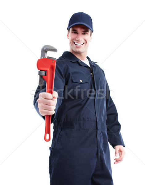 Hydraulik klucz nastawny uśmiechnięty przystojny człowiek pracy Zdjęcia stock © Kurhan