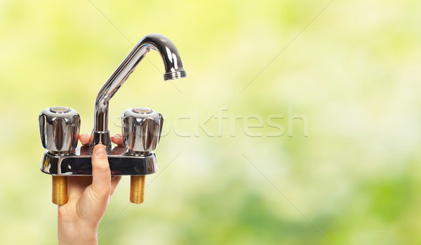 Kéz vízvezetékszerelő vízcsap ház rendbehoz építkezés Stock fotó © Kurhan
