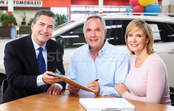 Senior couple with car dealer agent. Stock photo © Kurhan