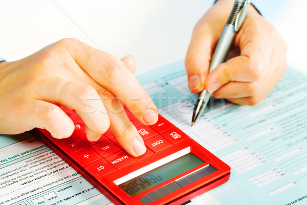 Hands with calculator. Stock photo © Kurhan