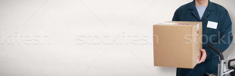 Delivery postman with a box. Stock photo © Kurhan