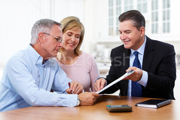 Senior couple with insurance agent. Stock photo © Kurhan