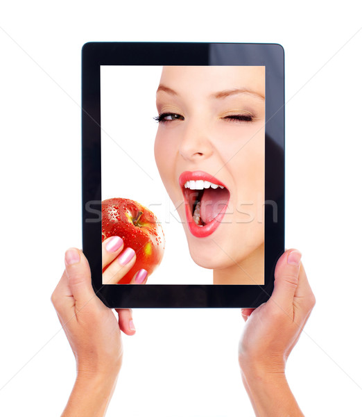 Tablet computer and woman with apple Stock photo © Kurhan