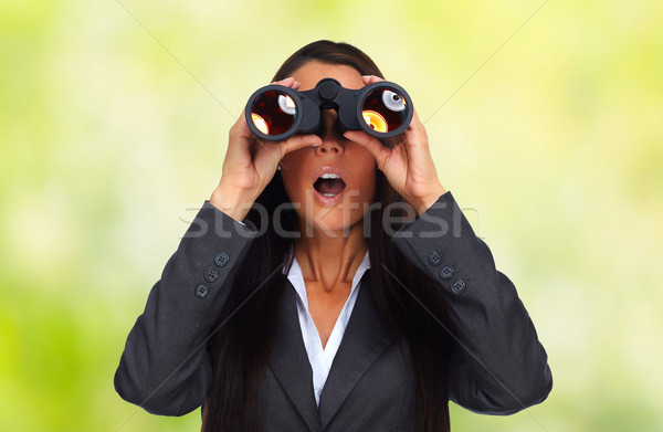 Business woman with binoculars. Stock photo © Kurhan