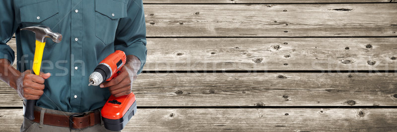 Worker man with hammer and drill. Stock photo © Kurhan