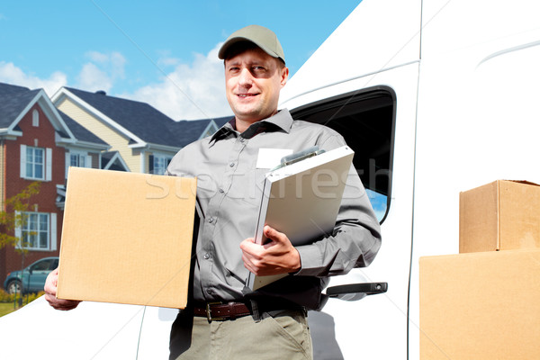 Entrega servicio postal hombre feliz profesional envío Foto stock © Kurhan