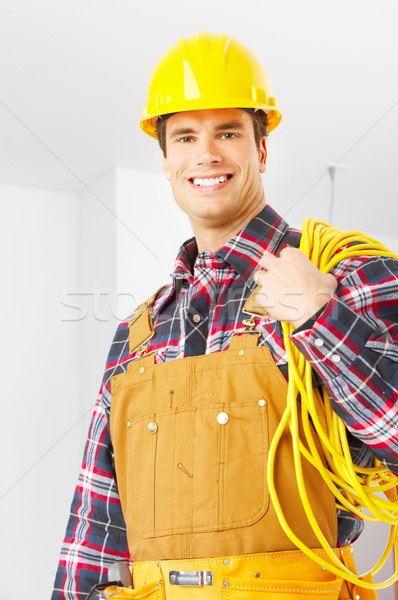 Builder sorridere bello giallo uniforme business Foto d'archivio © Kurhan