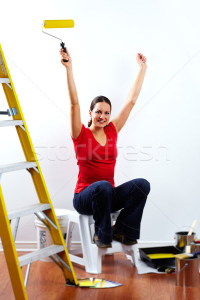 Beautiful woman with painting roller. Stock photo © Kurhan