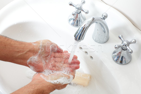 Man washing hands with soap and water. Stock photo © Kurhan