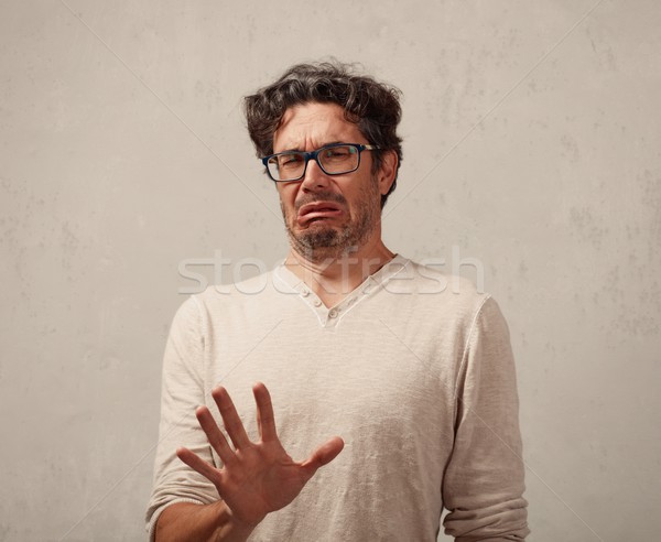 Om tânăr dezgust faţă expresii portret Imagine de stoc © Kurhan