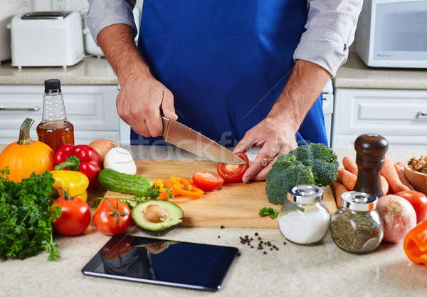 Chef man cooking in the kitchen. Stock photo © Kurhan