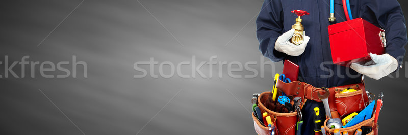 Plumber hands with tools. Stock photo © Kurhan