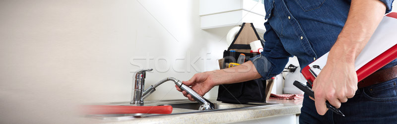 Plumber hands and water tap Stock photo © Kurhan