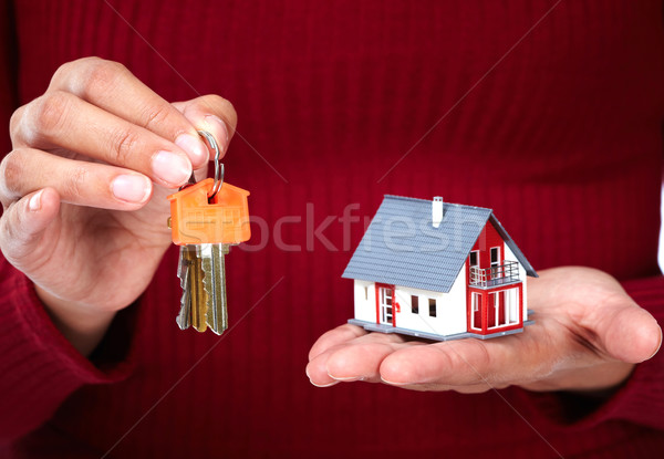 Woman Hands with little house and key. Stock photo © Kurhan