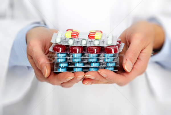 Doctor hands with pills. Stock photo © Kurhan