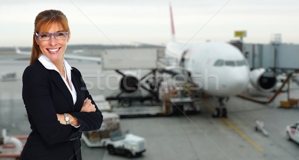 Gyönyörű utaskíserő hölgy mosolyog nő repülőgép Stock fotó © Kurhan
