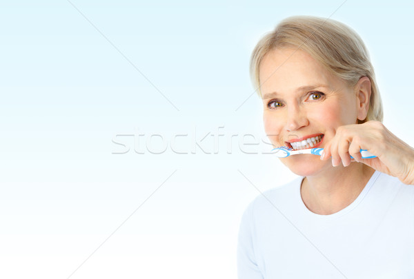 Foto stock: Mujer · cepillo · de · dientes · hermosa · mujer · madura · salud · azul