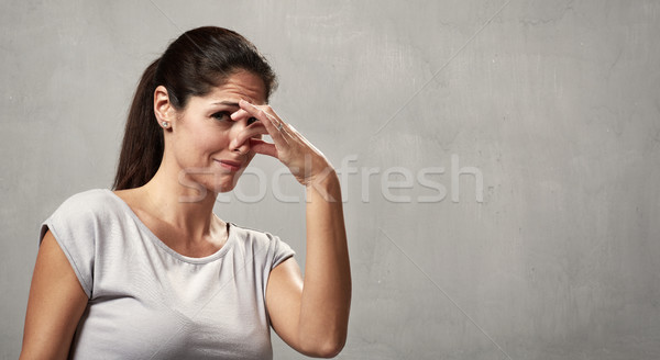 Girl disgusted face expression Stock photo © Kurhan