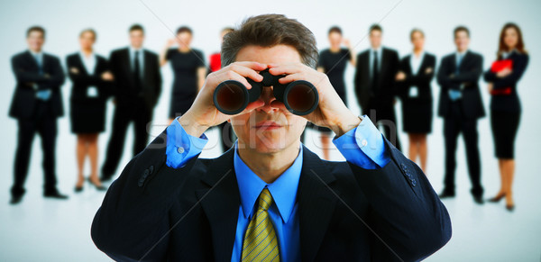 Businessman with binoculars. Stock photo © Kurhan