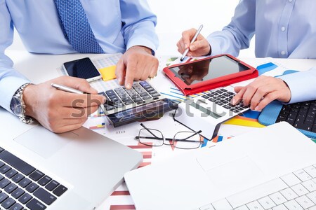 Stock photo: Hands of accountant businessman with calculator