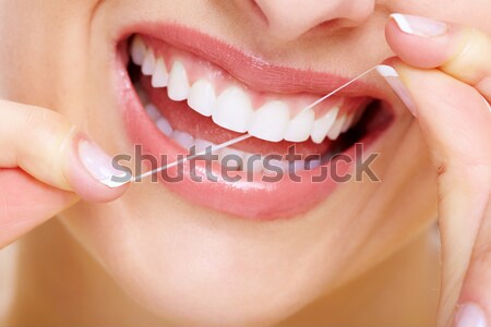Vrouw tanden mooie jonge vrouw geïsoleerd witte Stockfoto © Kurhan