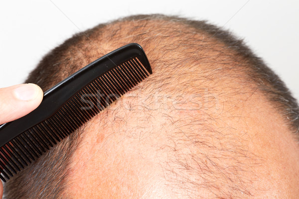 Man head with a comb. Stock photo © Kurhan