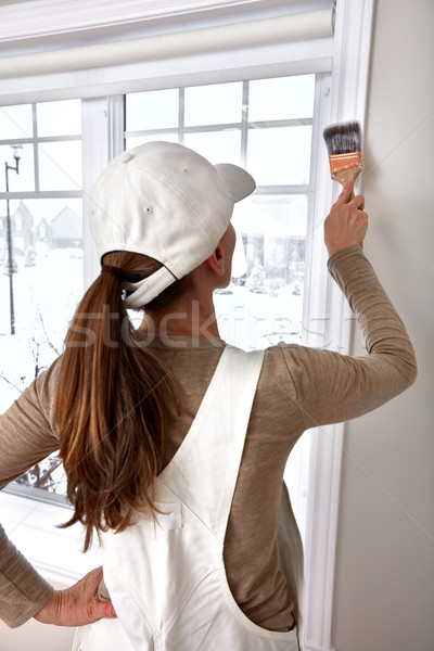 Woman painting window trim Stock photo © Kurhan