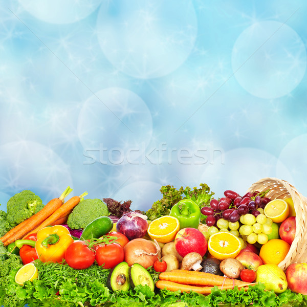 Vegetables and fruits over green background. Stock photo © Kurhan