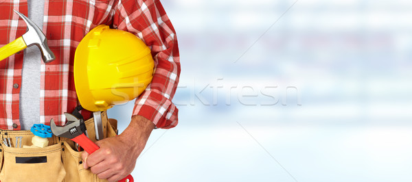 Builder handyman with construction tools. Stock photo © Kurhan