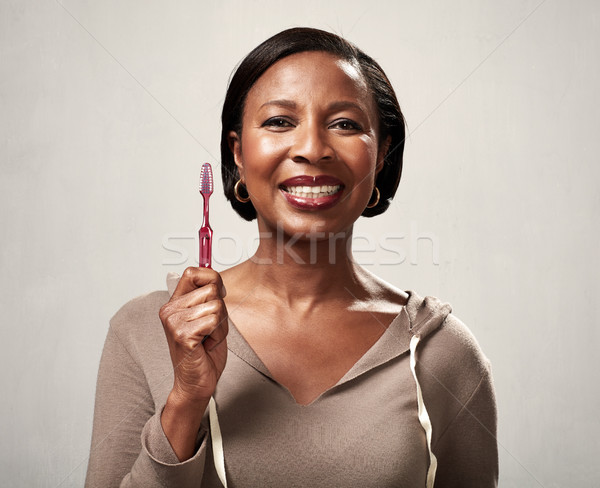 Black woman with toothbrush Stock photo © Kurhan