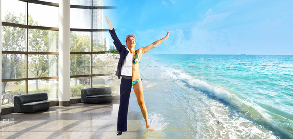 Happy business woman on the beach. Stock photo © Kurhan