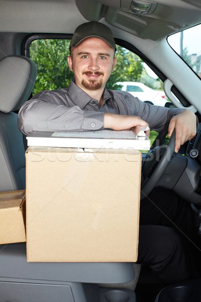 Young delivery man in the car. Stock photo © Kurhan