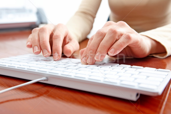 Woman typing Stock photo © Kurhan