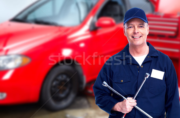 Car mechanic  with tire wrench. Stock photo © Kurhan