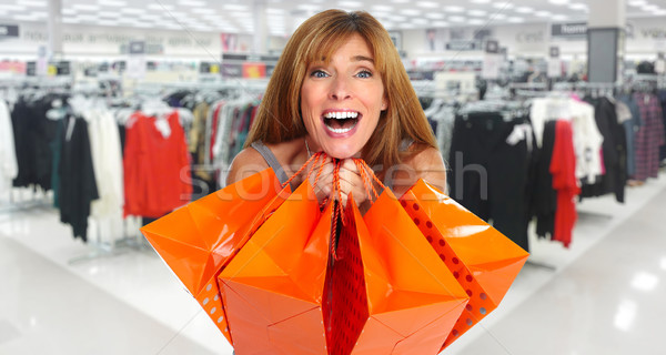 Stock photo: Shopping woman with  gifts.