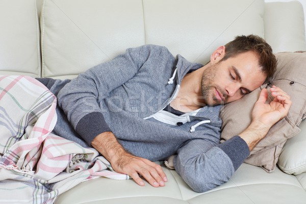 спальный человека молодые красивый мужчина диван Сток-фото © Kurhan