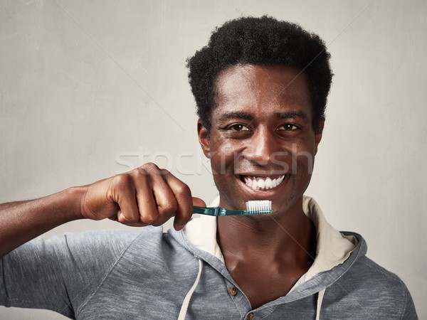 Man with toothbrush. Stock photo © Kurhan