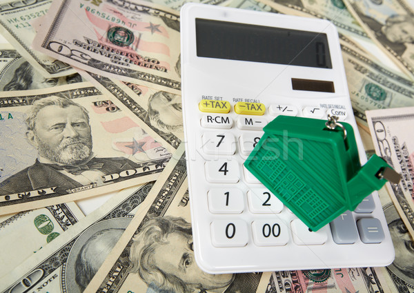 House money and calculator. Stock photo © Kurhan