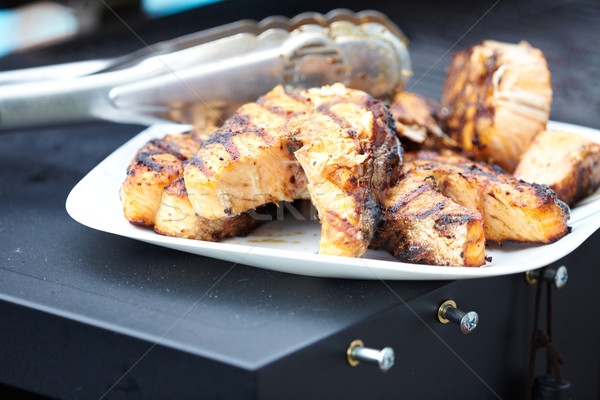 Salmon fish roasted on barbecue grill. Stock photo © Kurhan